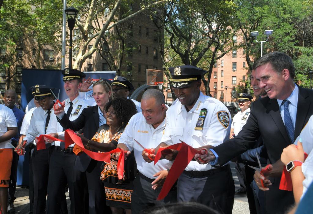 DA Melinda Katz, alongside NYPD officials and Queensbridge Houses Tenant Association President, cuts the ribbon for a newly renovated basketball court inside the Queensbridge housing development. August 12, 2021.
